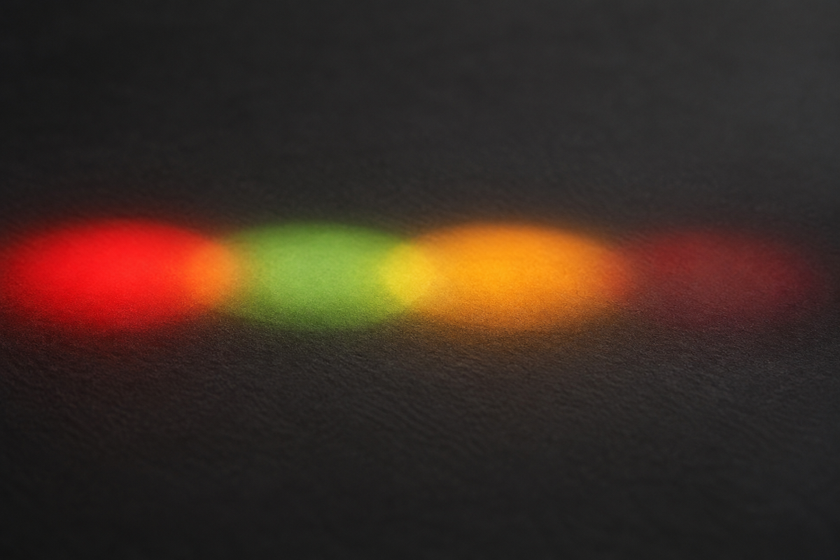 Four LED light colours - red, green, amber and a dim near-infrared glow - side by side on a dark background
