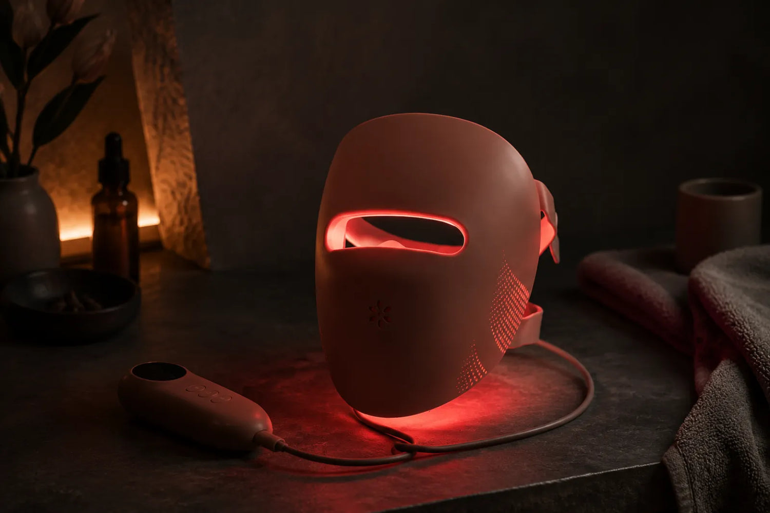 Lumovex red light therapy LED face mask glowing on a dark surface
