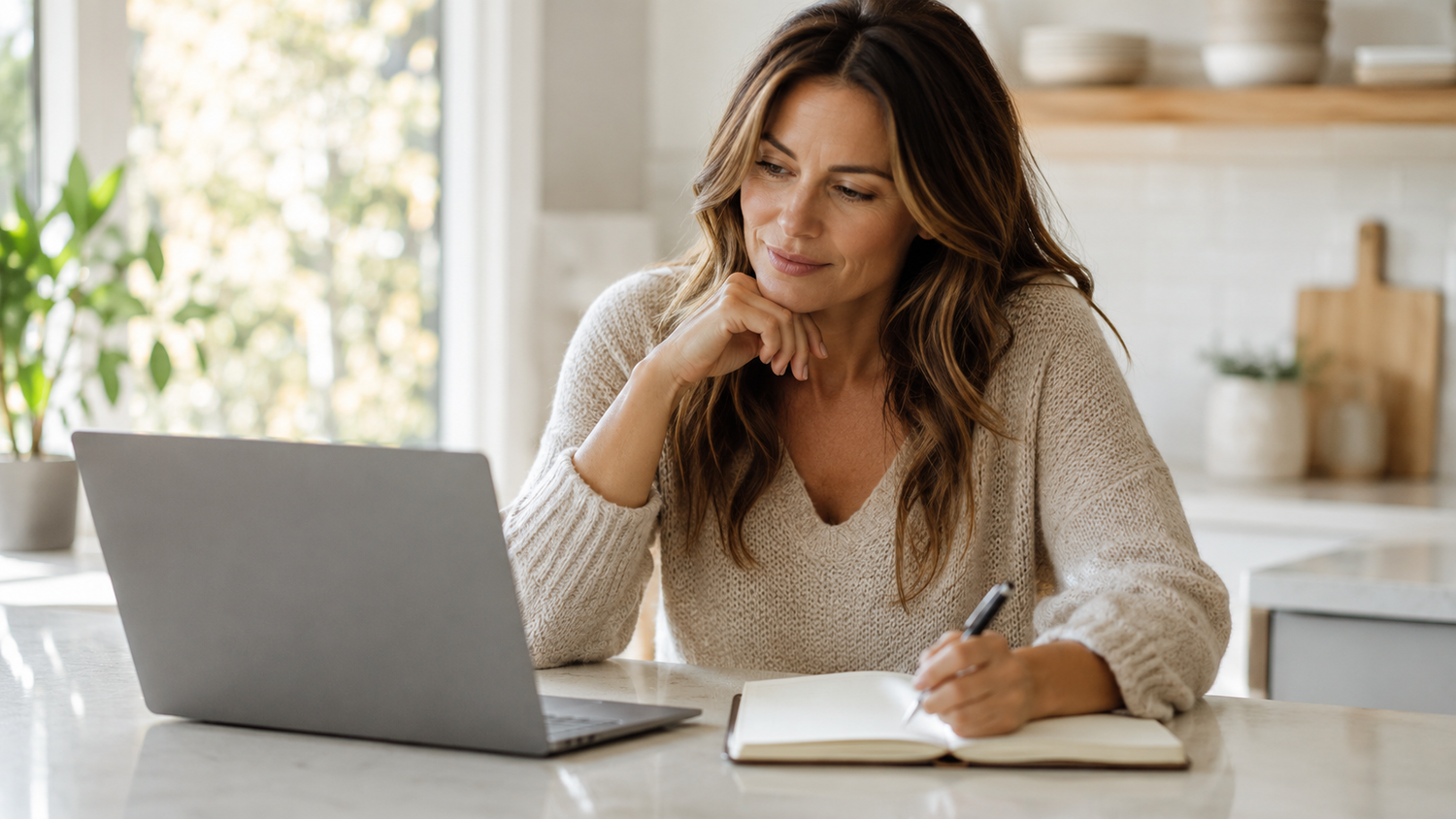 Woman comparing skincare device options on a laptop at home