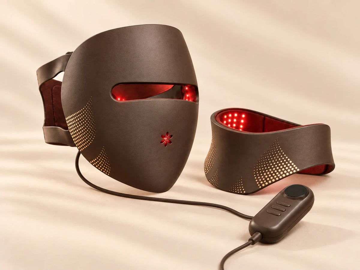 Brown Lumovex Spectrum Pro LED face mask and matching neck device with red LED illumination and wired controller on a cream background.