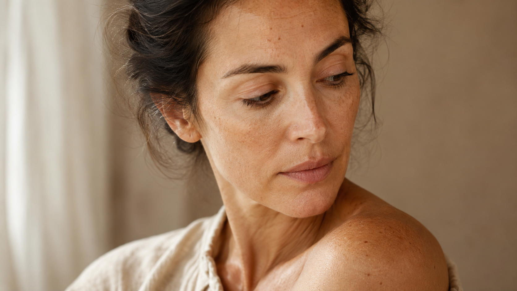 Soft natural light editorial close-up illustrating sun-exposed skin and recovery