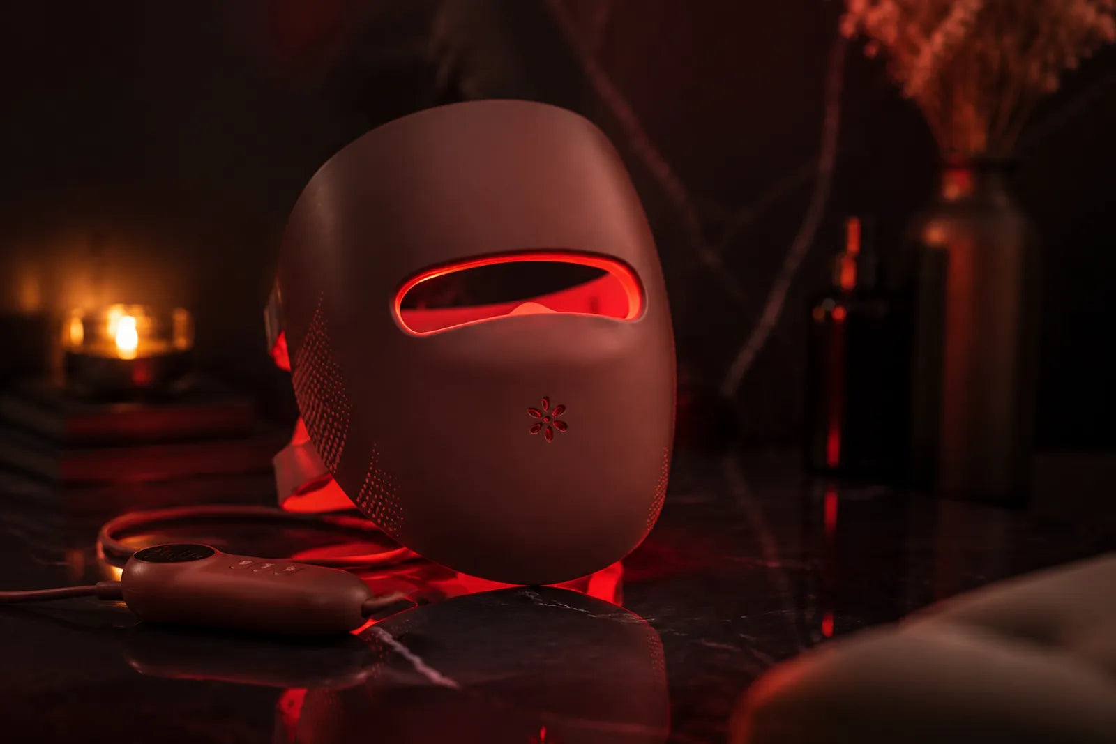 Premium Lumovex red light therapy LED face mask glowing on a dark surface