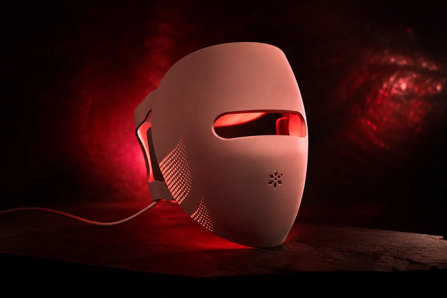 Lumovex LED face mask in a deep red glow, red light therapy safety guide