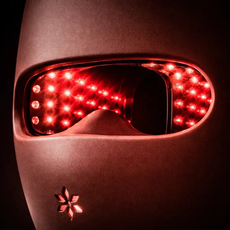 Woman wearing Lumovex Spectrum Pro LED therapy mask during at-home skincare session
