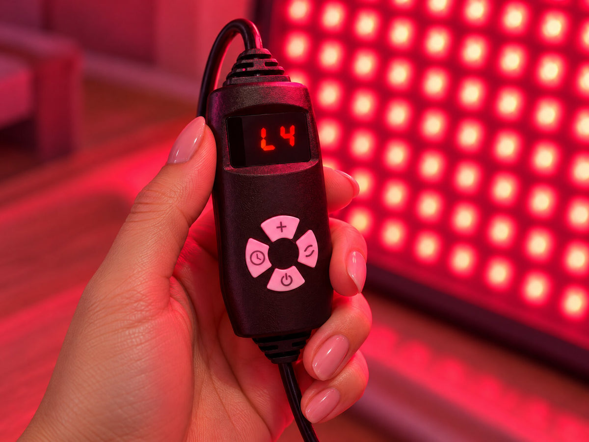 Lumovex Pro Panel 540 wired remote showing brightness level L4, with the lit panel glowing behind it